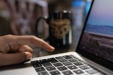 close up image of a person typing on a computer